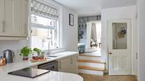 Step up from the kitchen into the cosy split-level snug for a movie of your choice.