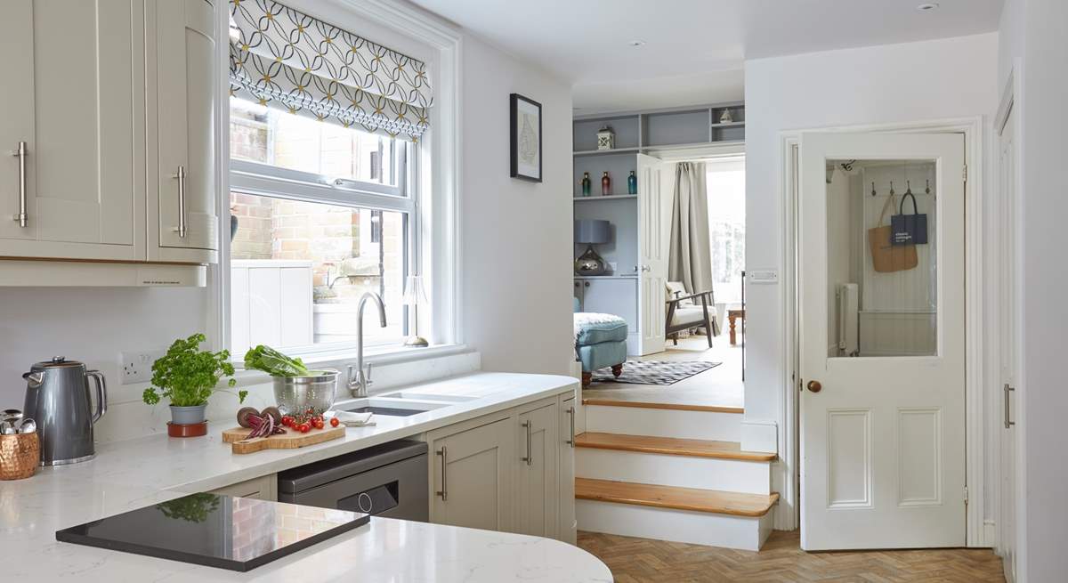 Step up from the kitchen into the cosy split-level snug for a movie of your choice.