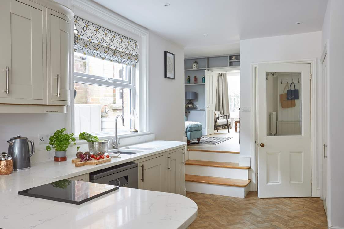Step up from the kitchen into the cosy split-level snug for a movie of your choice.