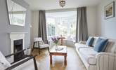 The light and airy sitting-room is a pleasure to relax in. - Thumbnail Image