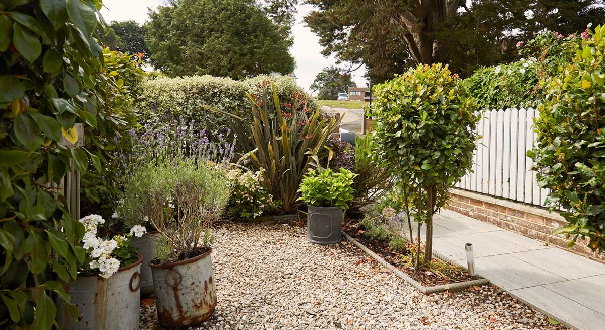 Charming front garden details capture the elegant essence of Maybury. 