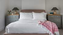 Lovely linens in the stylish light-filled front bedroom.