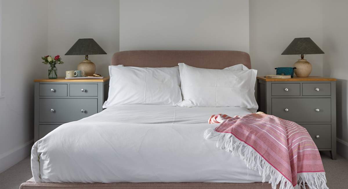 Lovely linens in the stylish light-filled front bedroom.