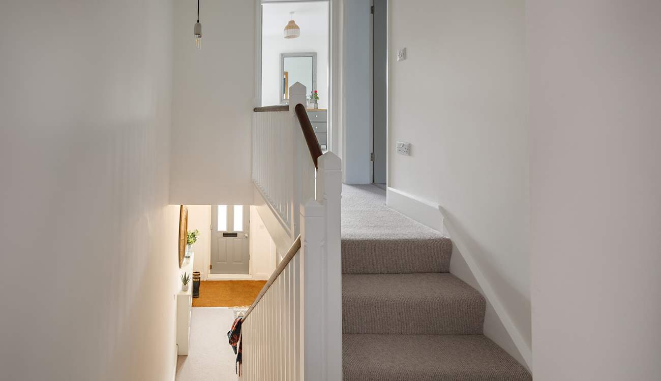 Climb the steps to the light-filled bedrooms.