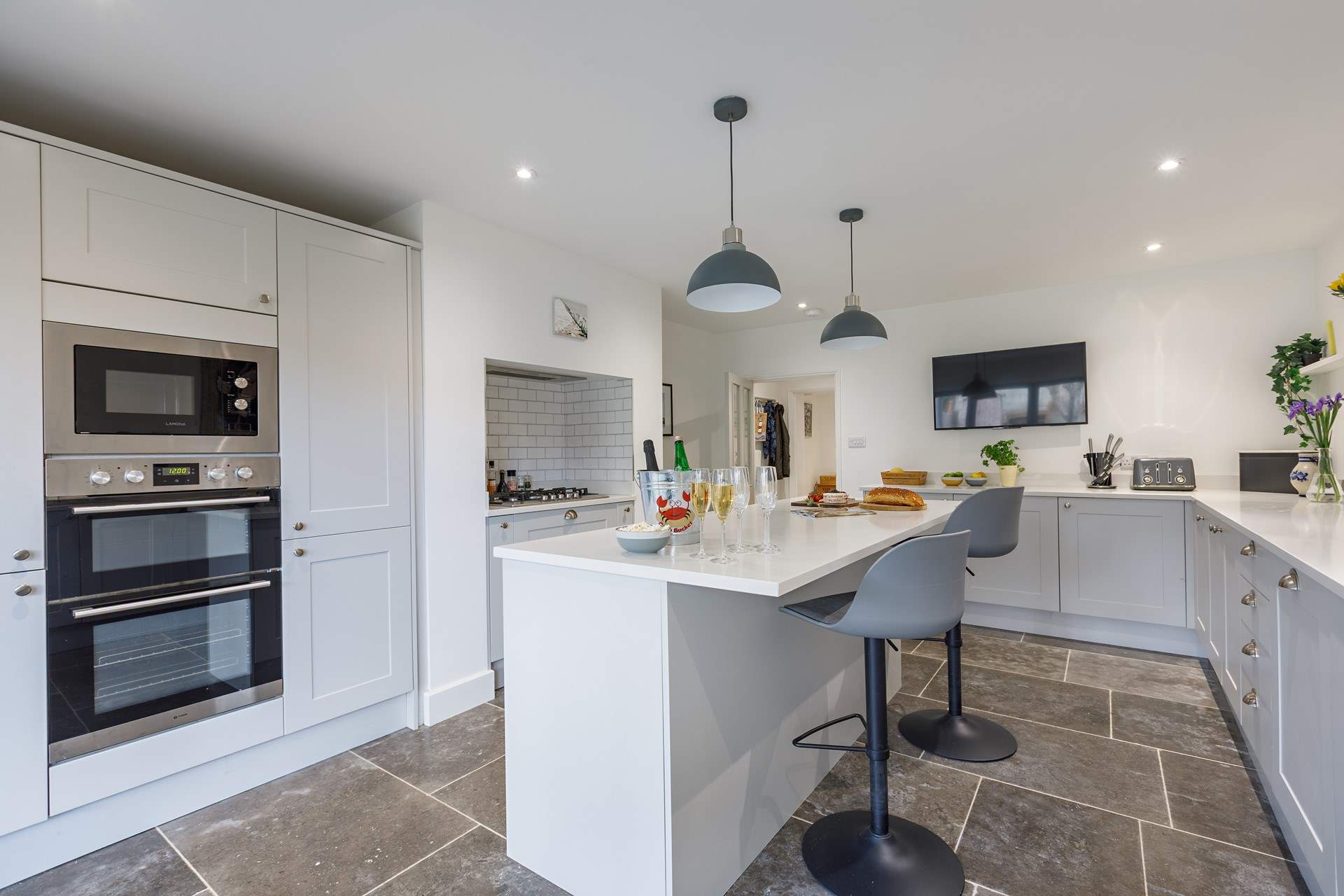 Pre-dinner drinks in the gorgeous kitchen, great for catching up with dear friends.