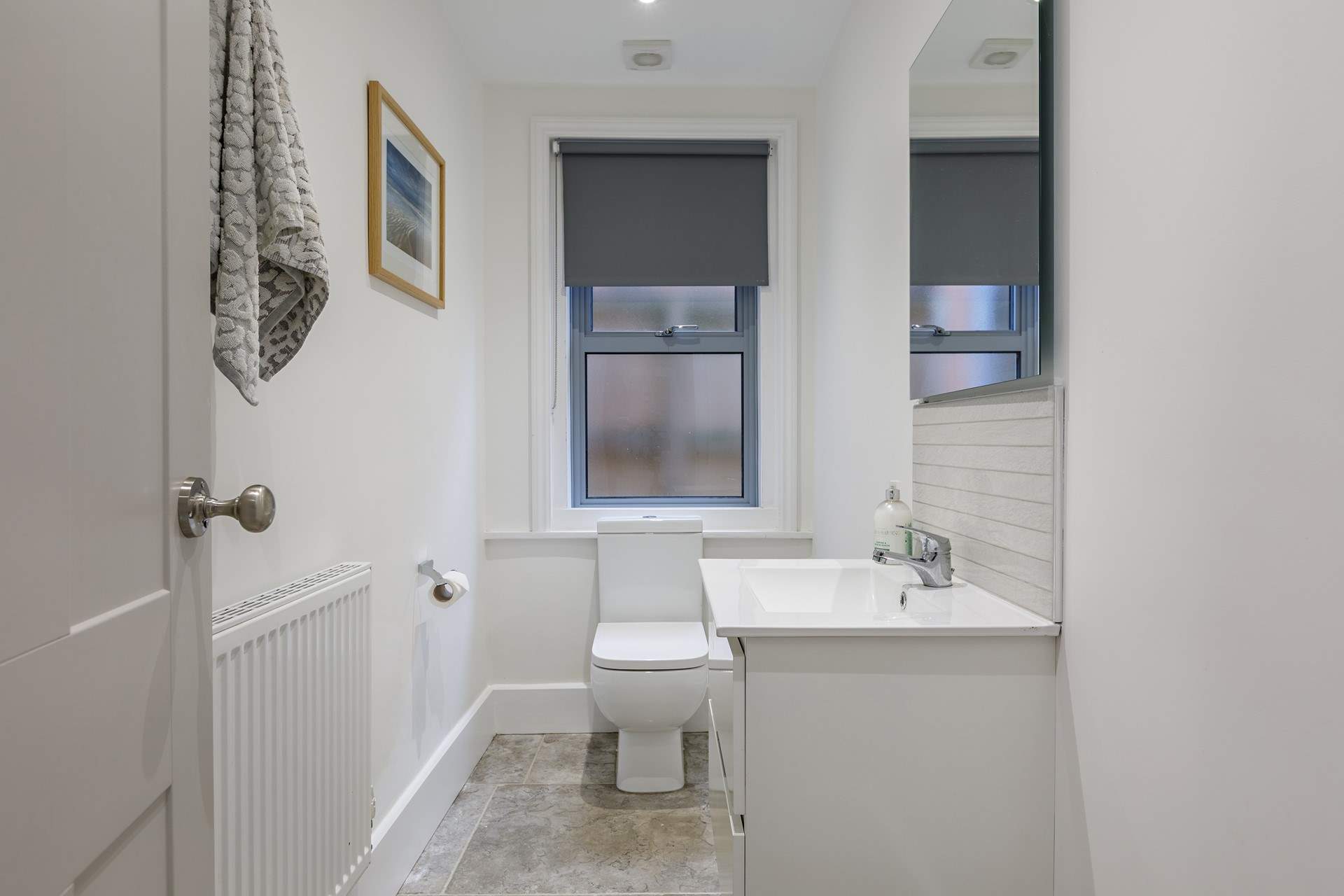 The downstairs cloakroom is light and roomy.