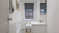 The downstairs cloakroom is light and roomy.