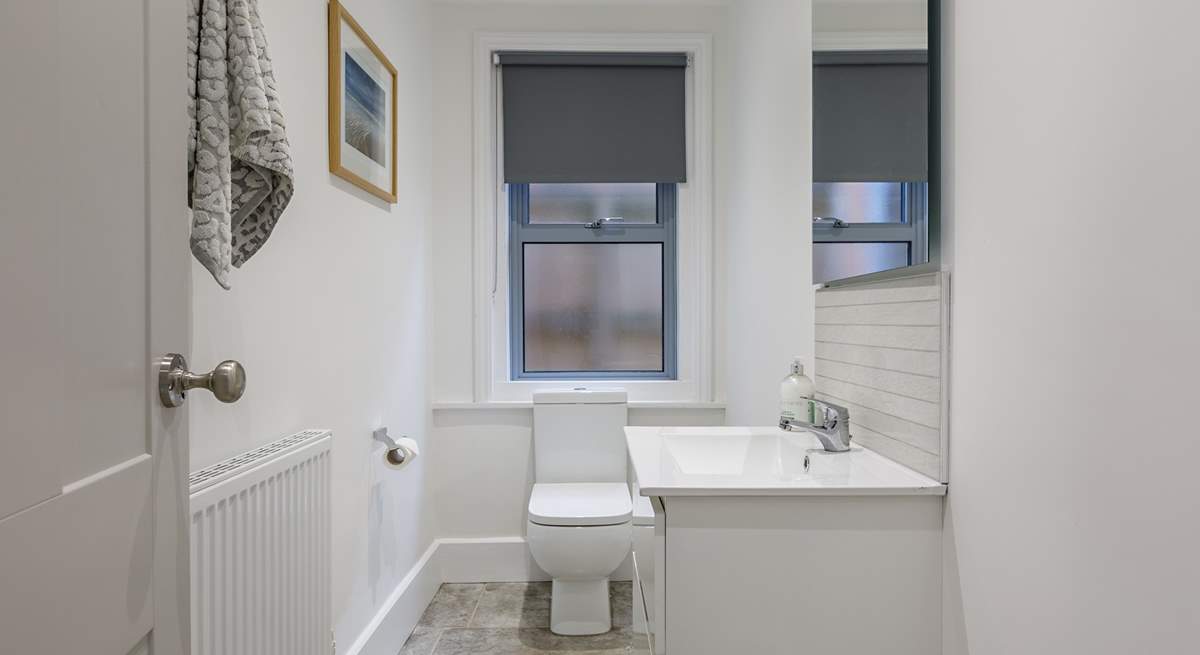 The downstairs cloakroom is light and roomy.