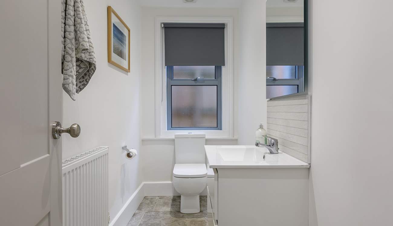 The downstairs cloakroom is light and roomy.