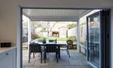 Enjoy the covered terrace with easy access from the kitchen. - Thumbnail Image