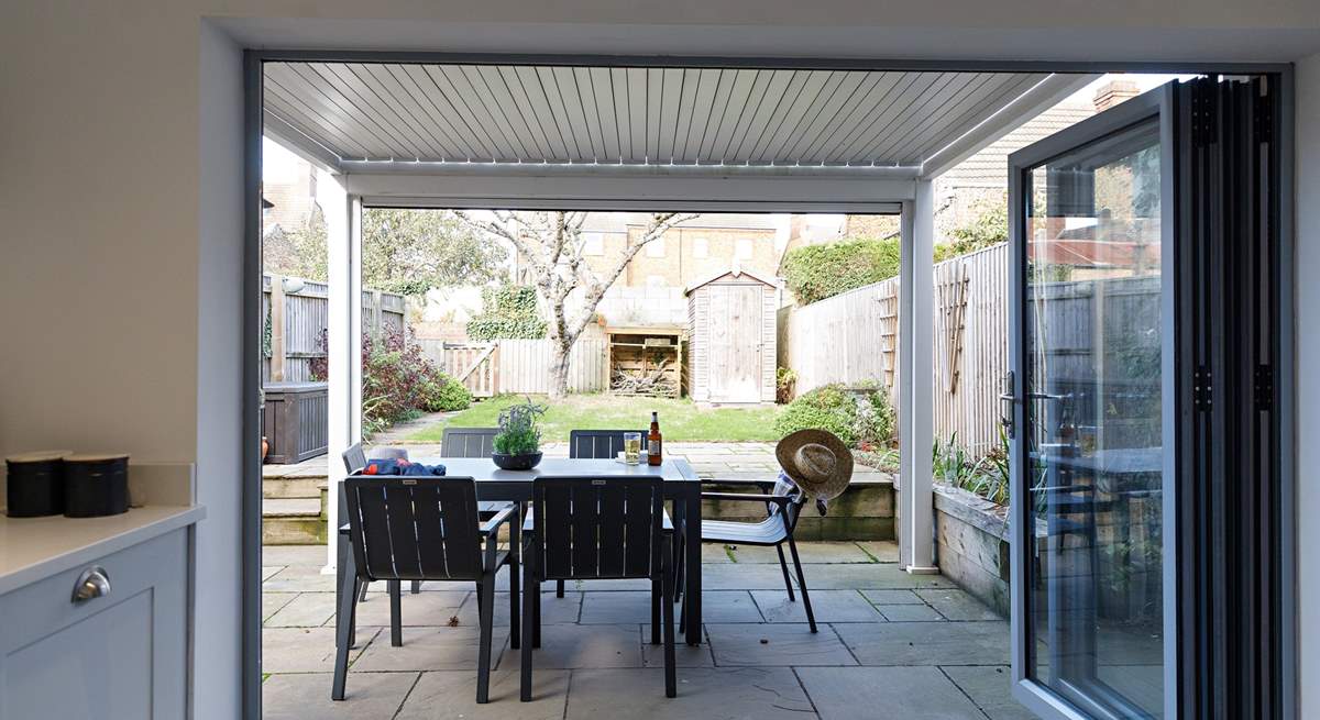 Enjoy the covered terrace with easy access from the kitchen.