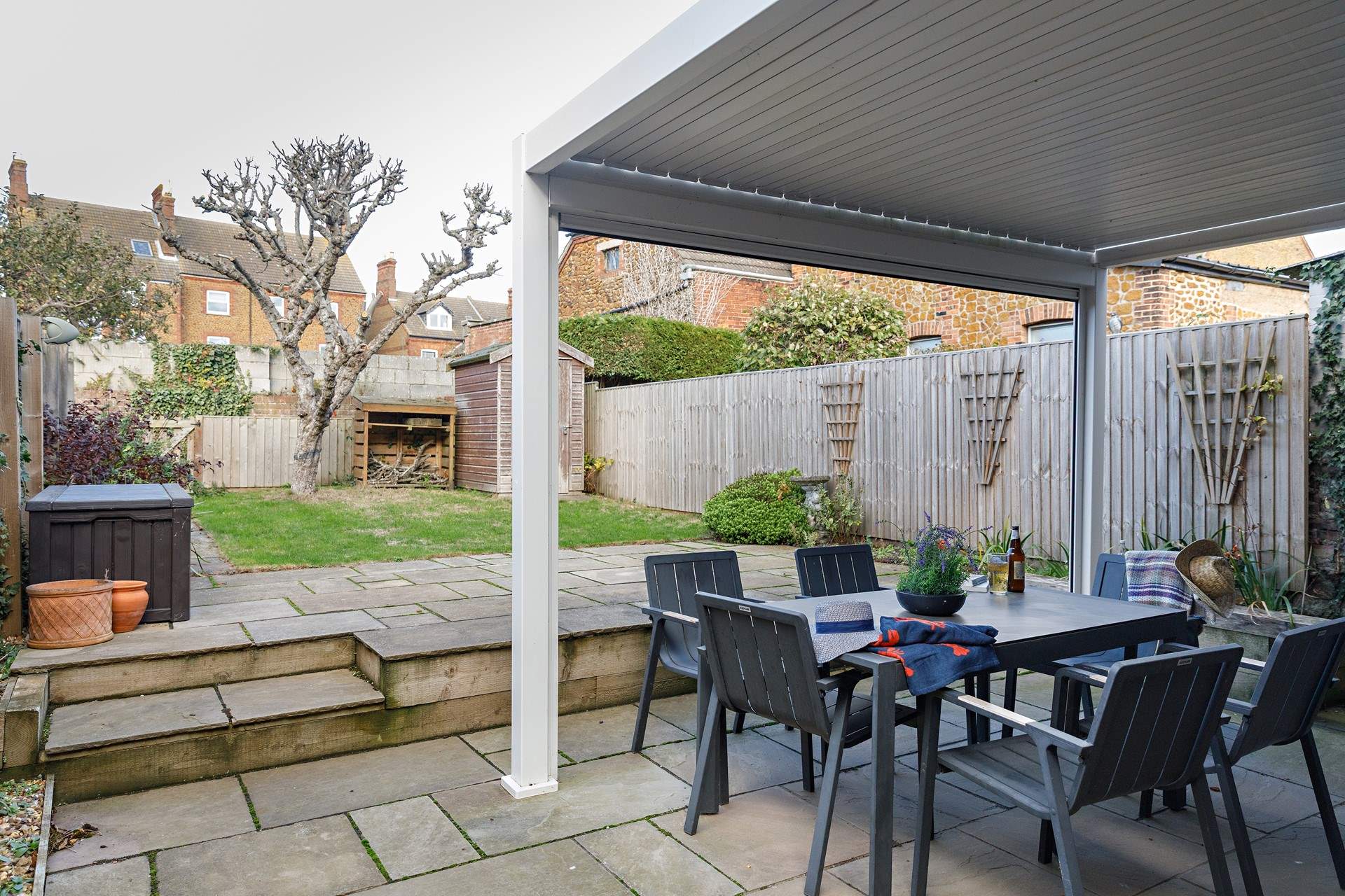 A fully enclosed garden is great for your four-legged friends, with shade under the apple tree.