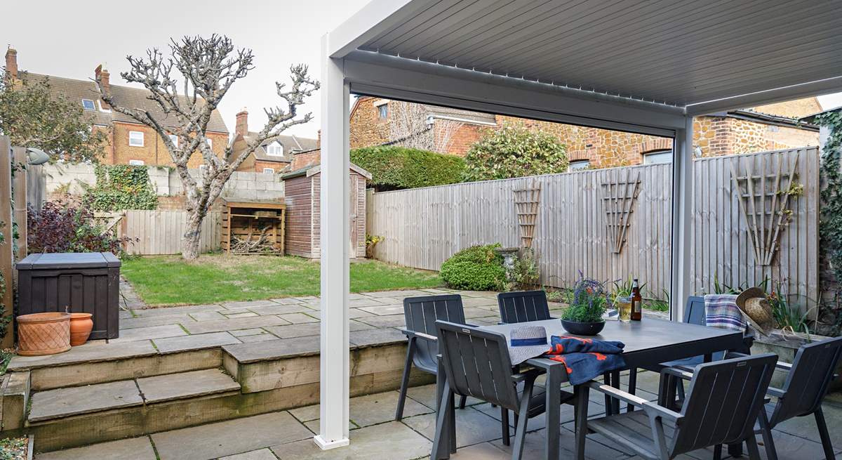 A fully enclosed garden is great for your four-legged friends, with shade under the apple tree.