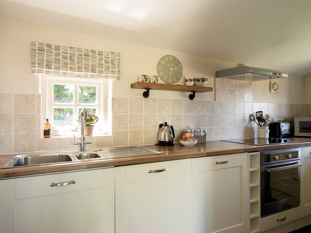 Sweet, well-equipped cottage kitchen.