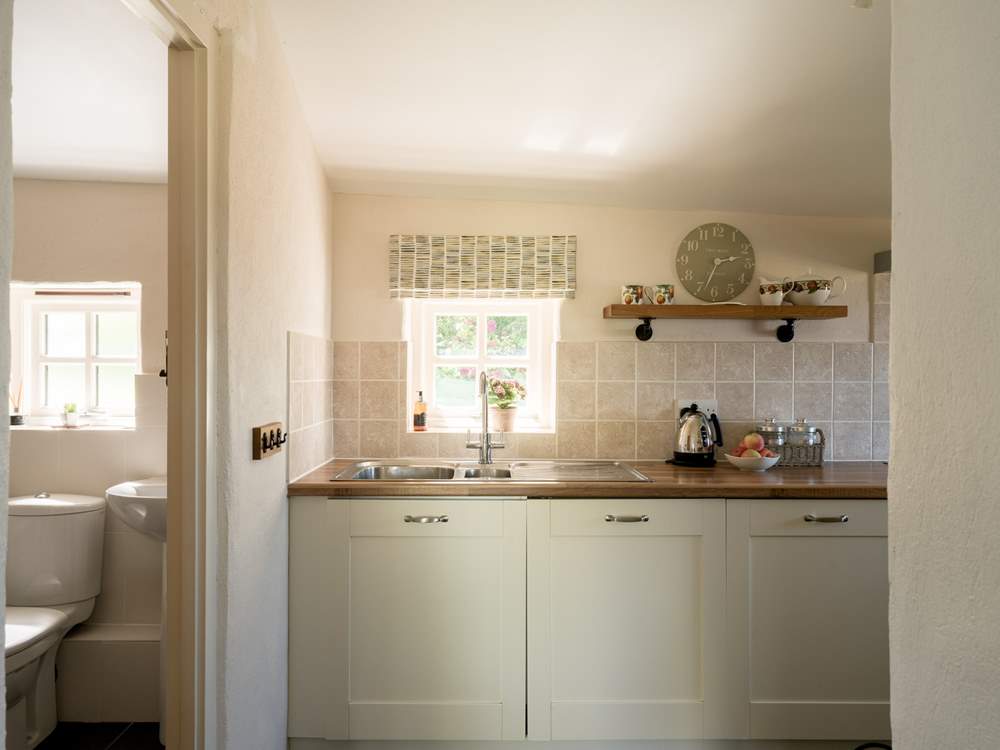 Sunlight streams through the pretty cottage window.