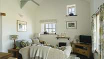 Stylish throughout with beamed high ceilings and a  sea view. Perfect for relaxing after a day in the sea air. 