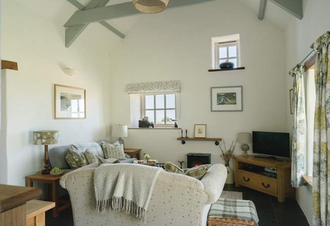 Stylish throughout with beamed high ceilings and a  sea view. Perfect for relaxing after a day in the sea air. 