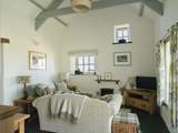 Stylish throughout with beamed high ceilings and a  sea view. Perfect for relaxing after a day in the sea air.