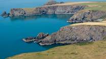 From Pencaer follow the coast path and take in the exquisite blue sea off the North Pembrokeshire Coast. 