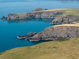 From Pencaer follow the coast path and take in the exquisite blue sea off the North Pembrokeshire Coast.