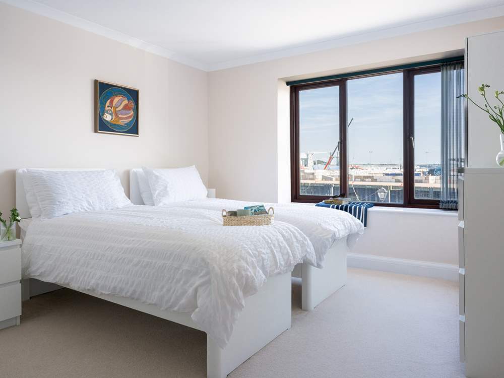 The second bedroom is light and airy.