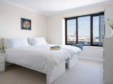 The second bedroom is light and airy.