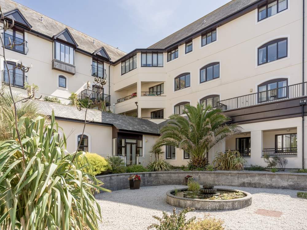 Pendennis Tides' balcony is on the first floor, just to the left of the big palm tree.