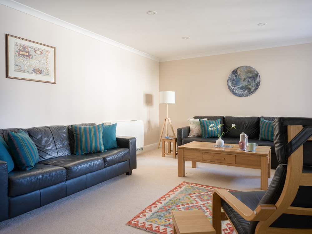 The large sitting-room is a great spot to relax in at the end of the day.