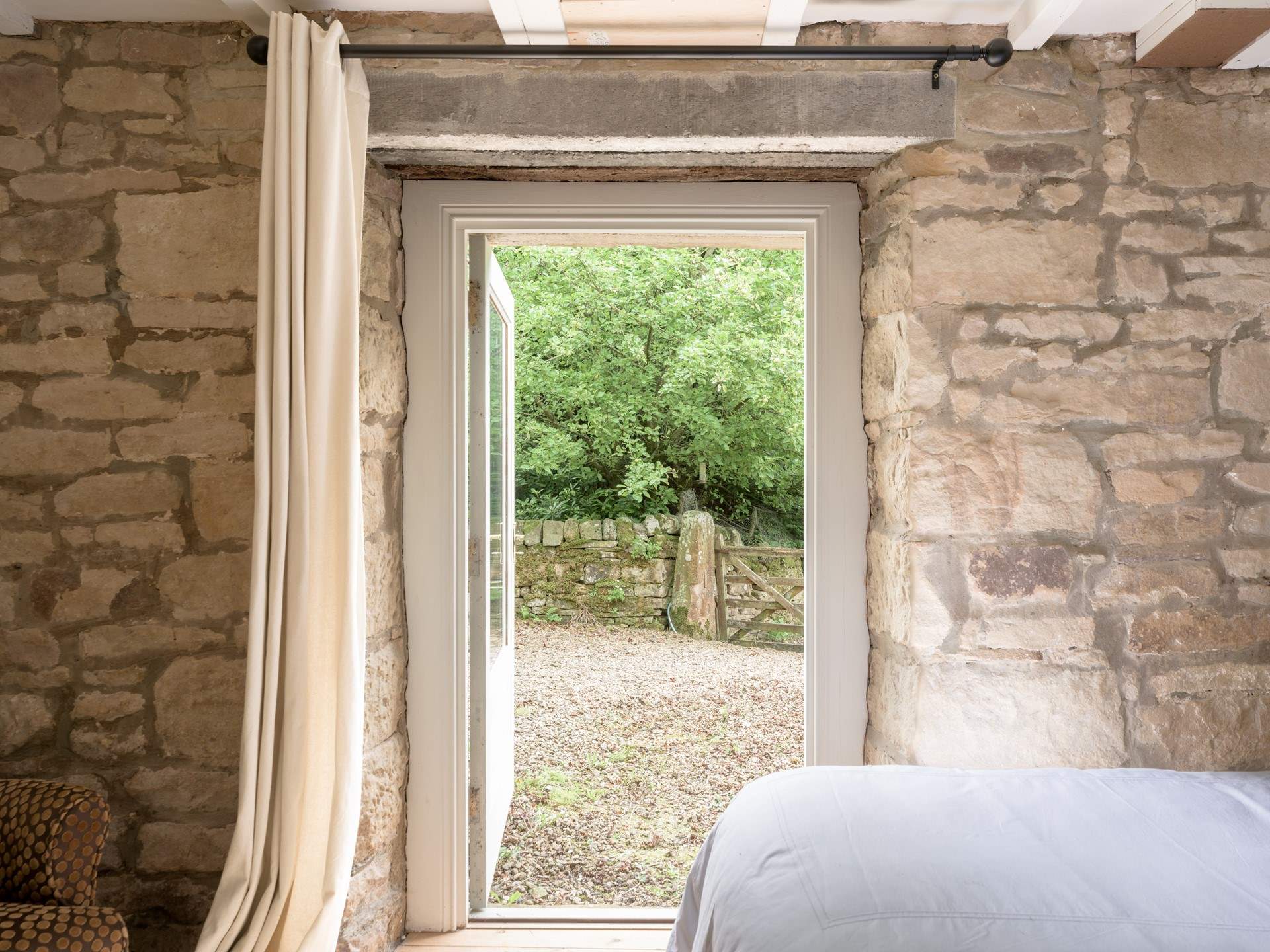 Straight out to the views of the fields and trees, the birdsong awaits. 