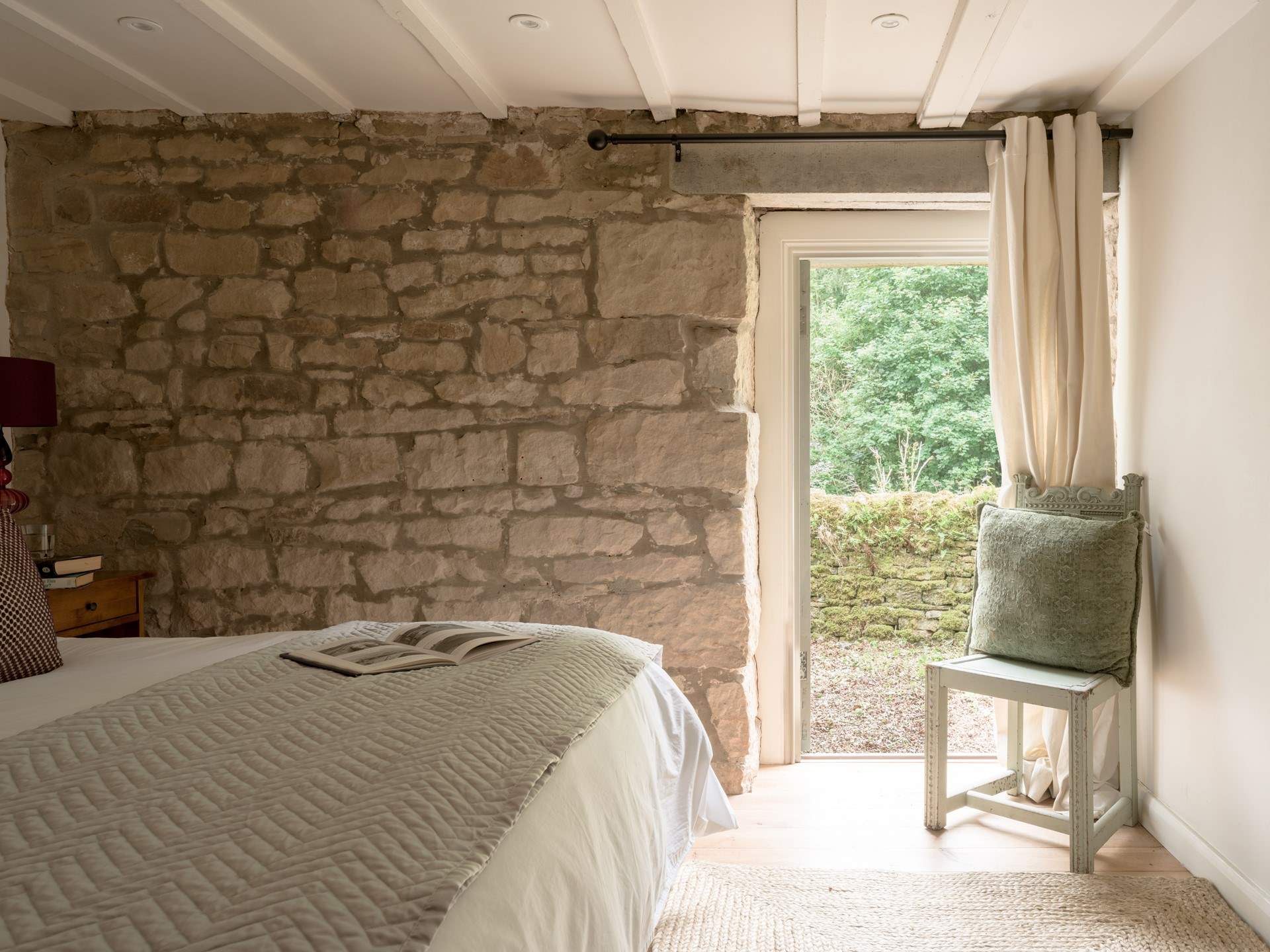 The calming colours of the soft furnishings make this bedroom a dream.