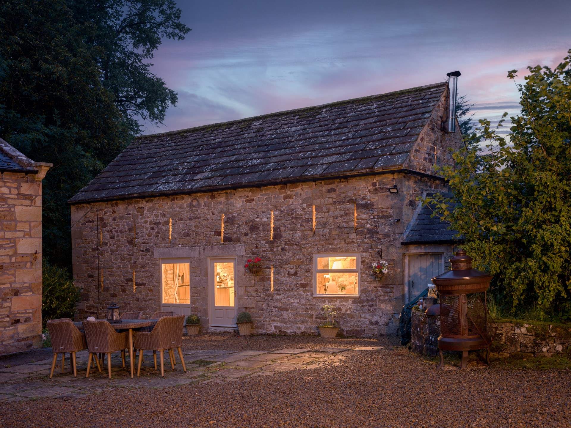 The historic arrow slits light up at night.