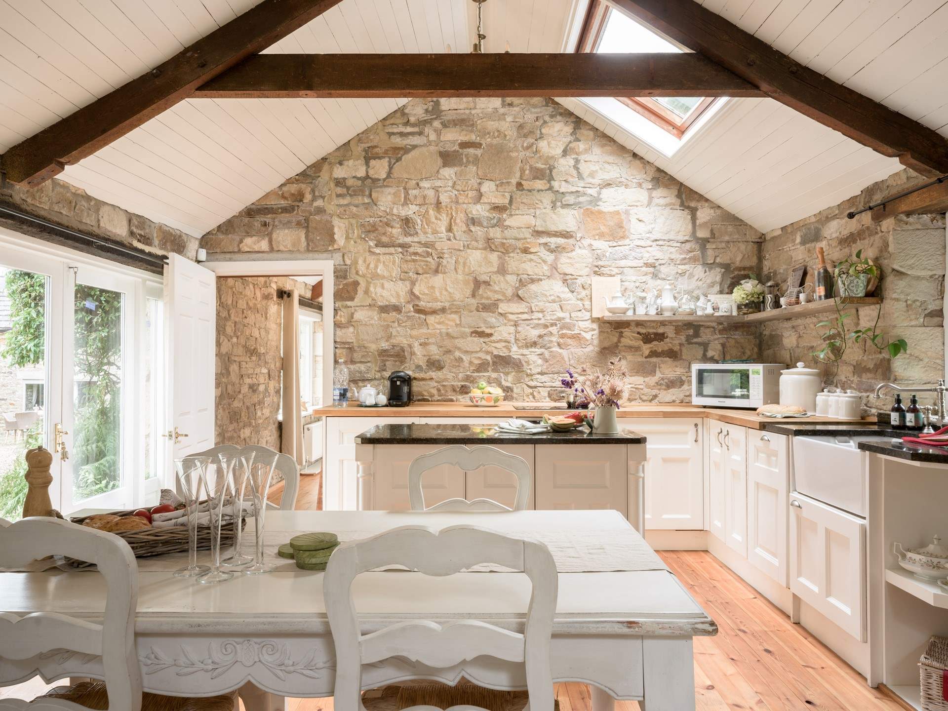 The open plan living area has lovely large windows letting in lots of sunlight.