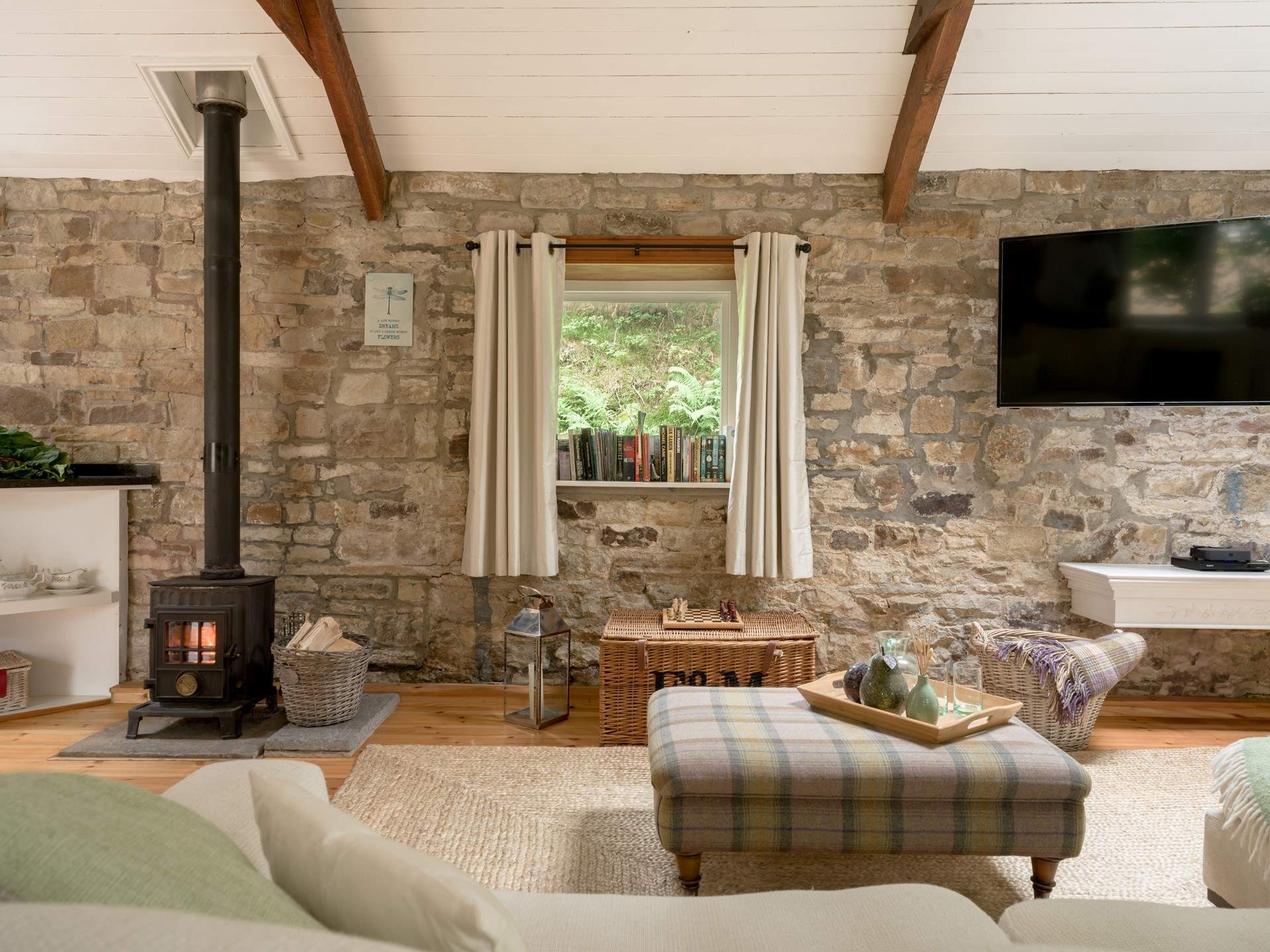 Natural stone is showcased in the open plan living area. 