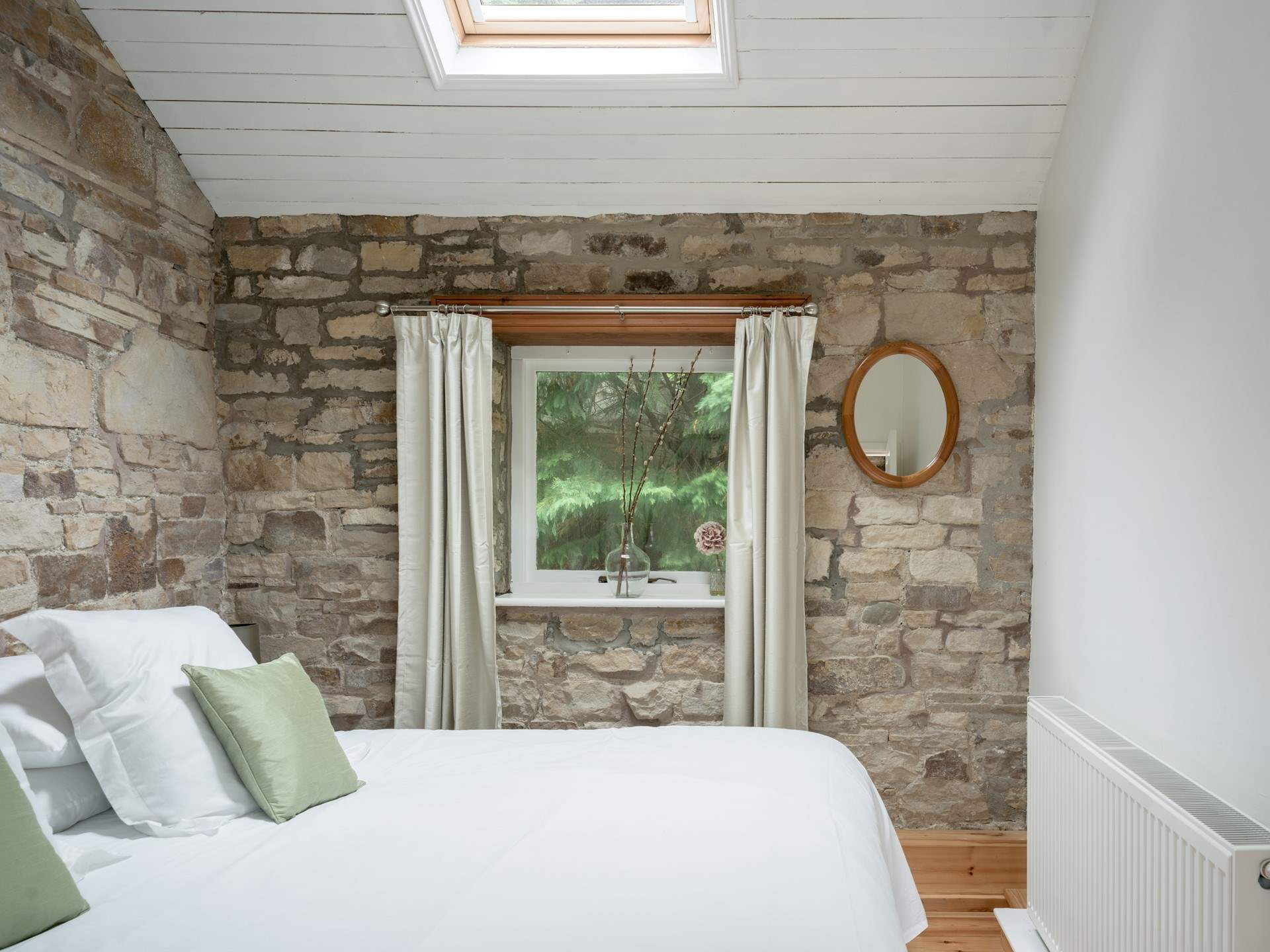 The stone walls show the original use of the cottage. 