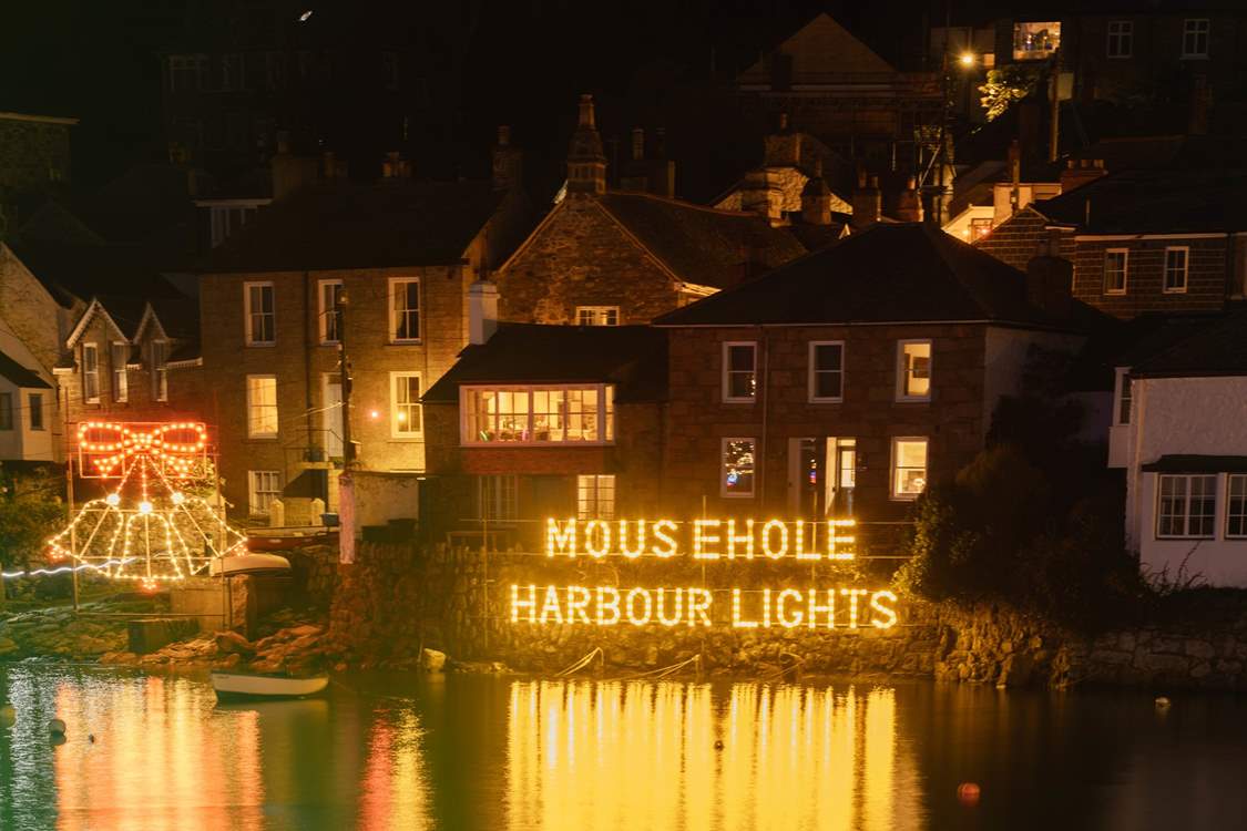 Visit at Christmas and enjoy the famous light display in Mousehole harbour.