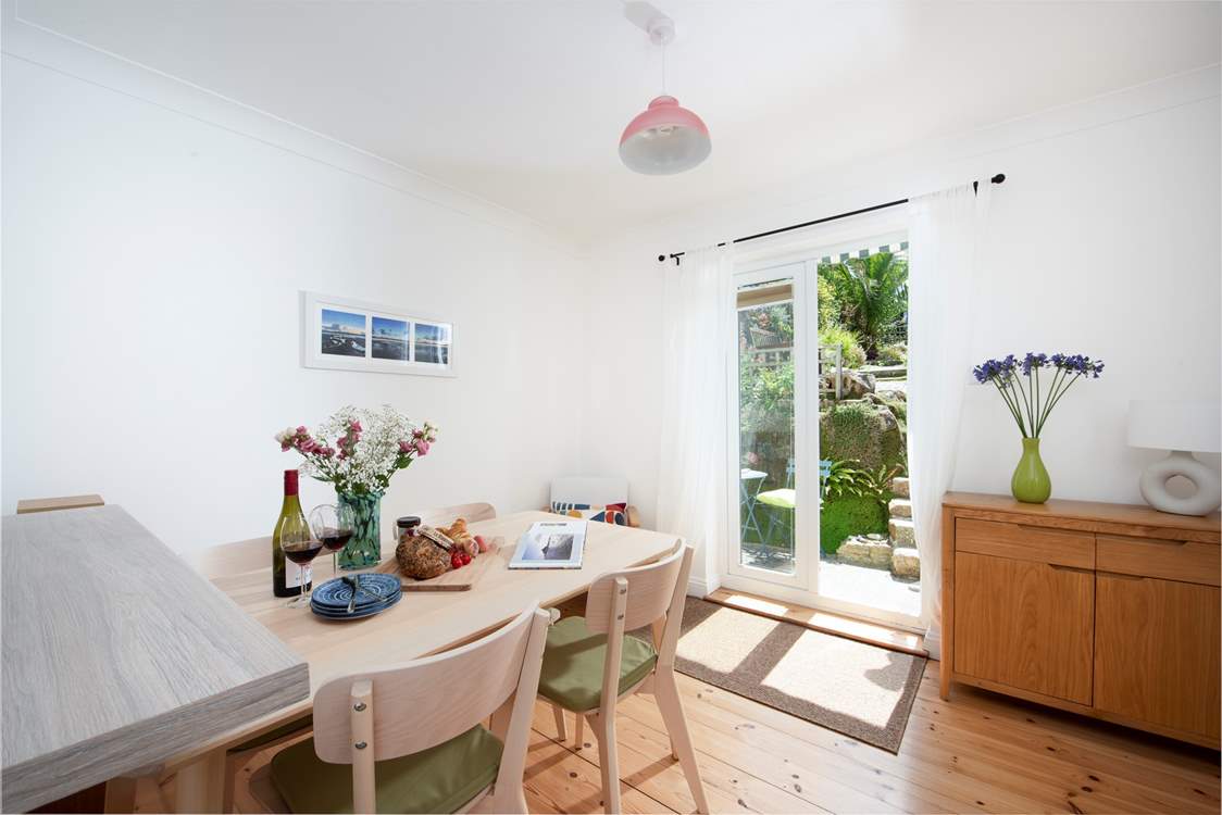 The dining-area leads directly onto the two-tiered garden.