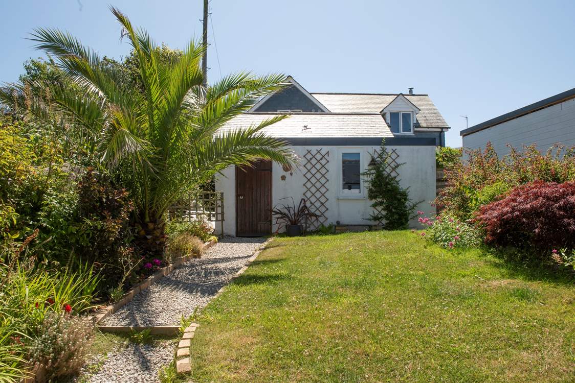 The lovely garden is fully enclosed. You have private parking next to the owners' garage shown here and can enter through the back gate.