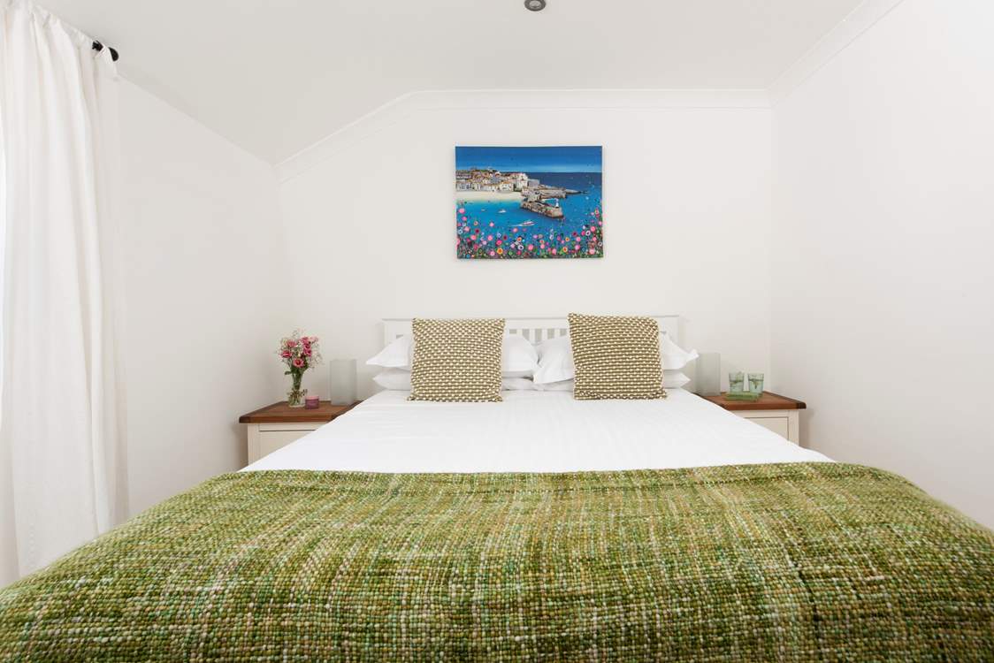 Bedroom 1 is beautifully presented and has a luxurious king-size bed.