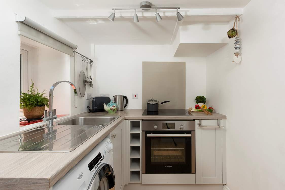 A bright and modern cottage kitchen so well-equipped for an aspiring chef.