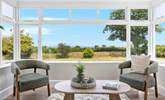 Take a pew in the sun-room and  soak in the setting, across the garden and over the rolling countryside to Dartmoor in the distance. - Thumbnail Image