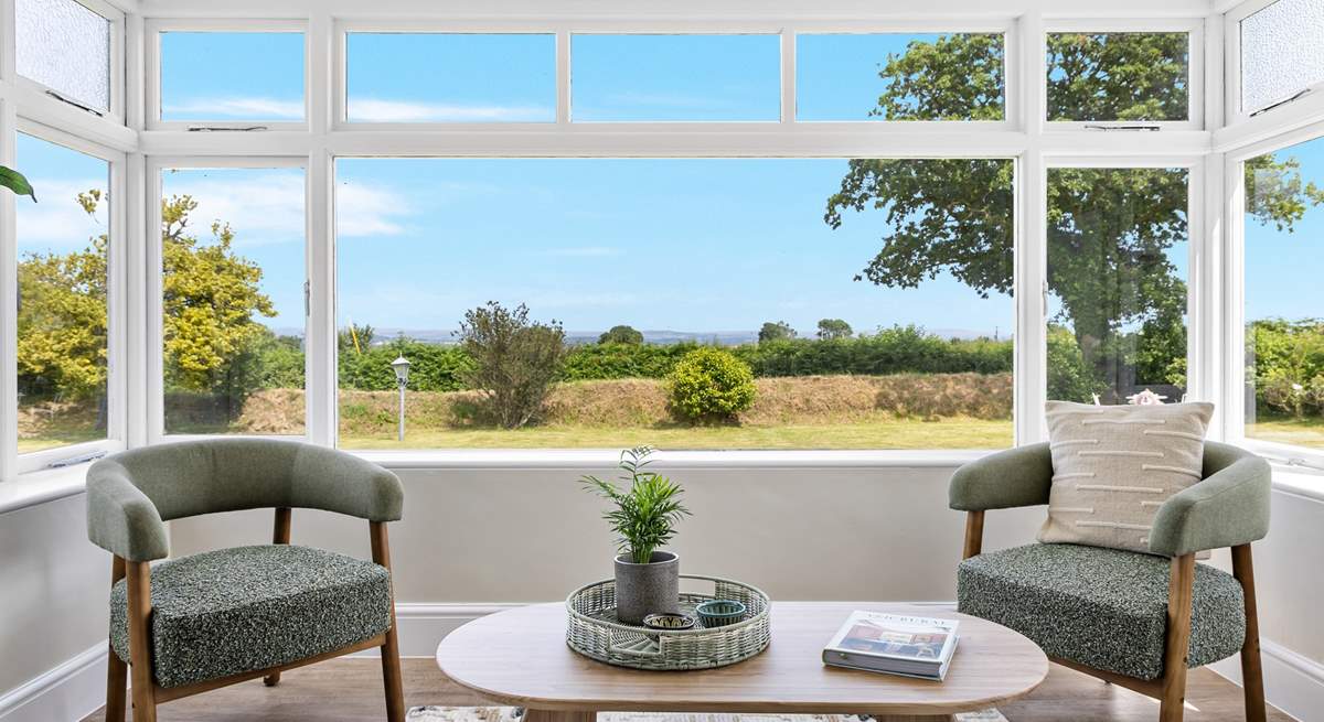 Take a pew in the sun-room and  soak in the setting, across the garden and over the rolling countryside to Dartmoor in the distance.