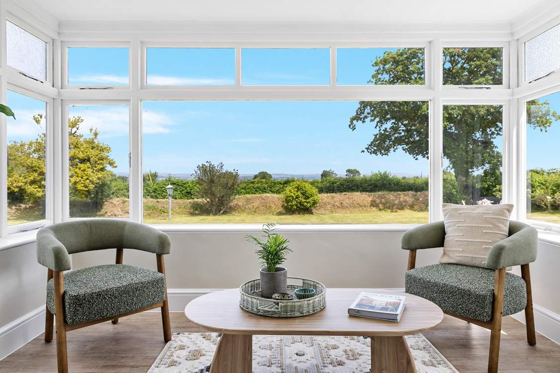 Take a pew in the sun-room and soak in the setting, across the garden and over the rolling countryside to Dartmoor in the distance.