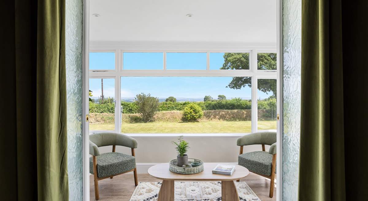 The little sun-room leads off from the sitting-room. From here you can also access the garden.