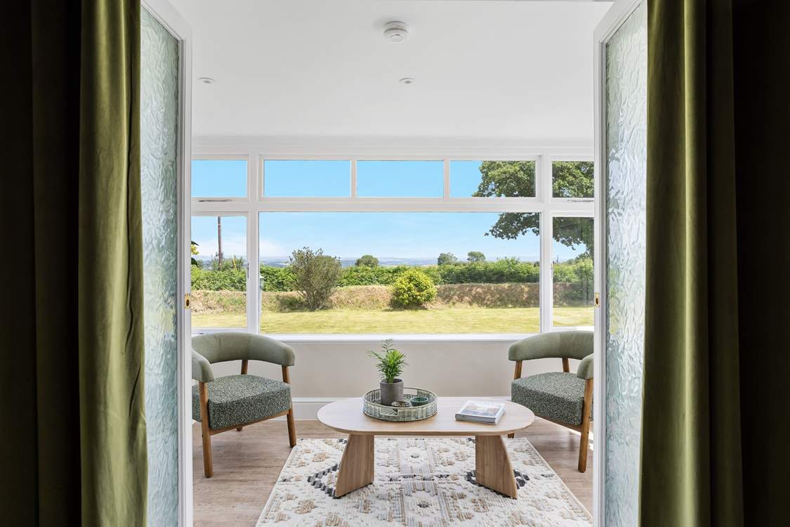 The little sun-room leads off from the sitting-room. From here you can also access the garden.