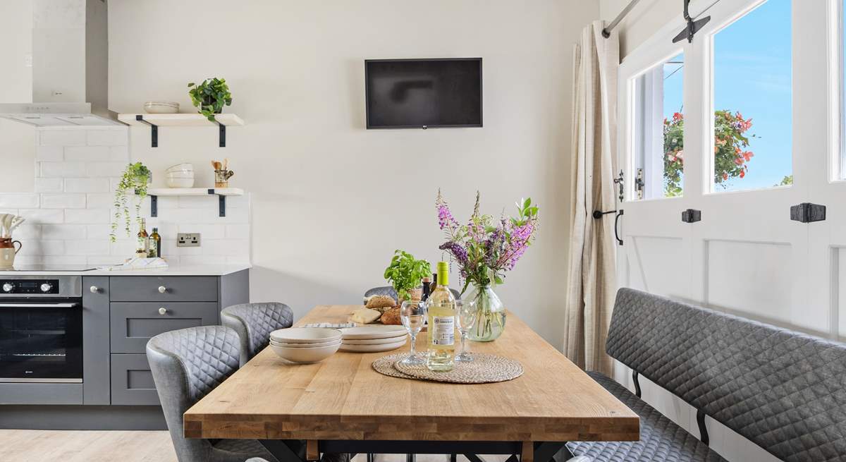 The old garage doors have been cleverly crafted to create a feature in the room.