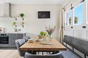 The old garage doors have been cleverly crafted to create a feature in the room.