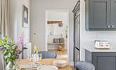 The kitchen/dining-room is a step down from the hallway. - Thumbnail Image