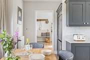 The kitchen/dining-room is a step down from the hallway.