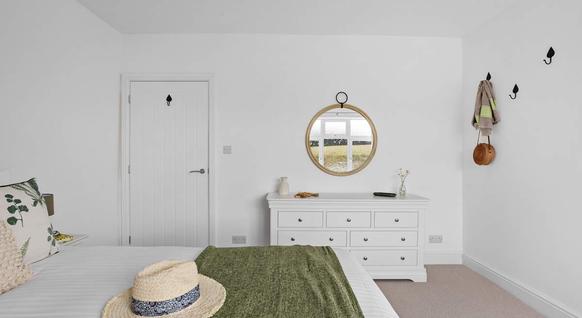 The soft furnishings complement the setting.