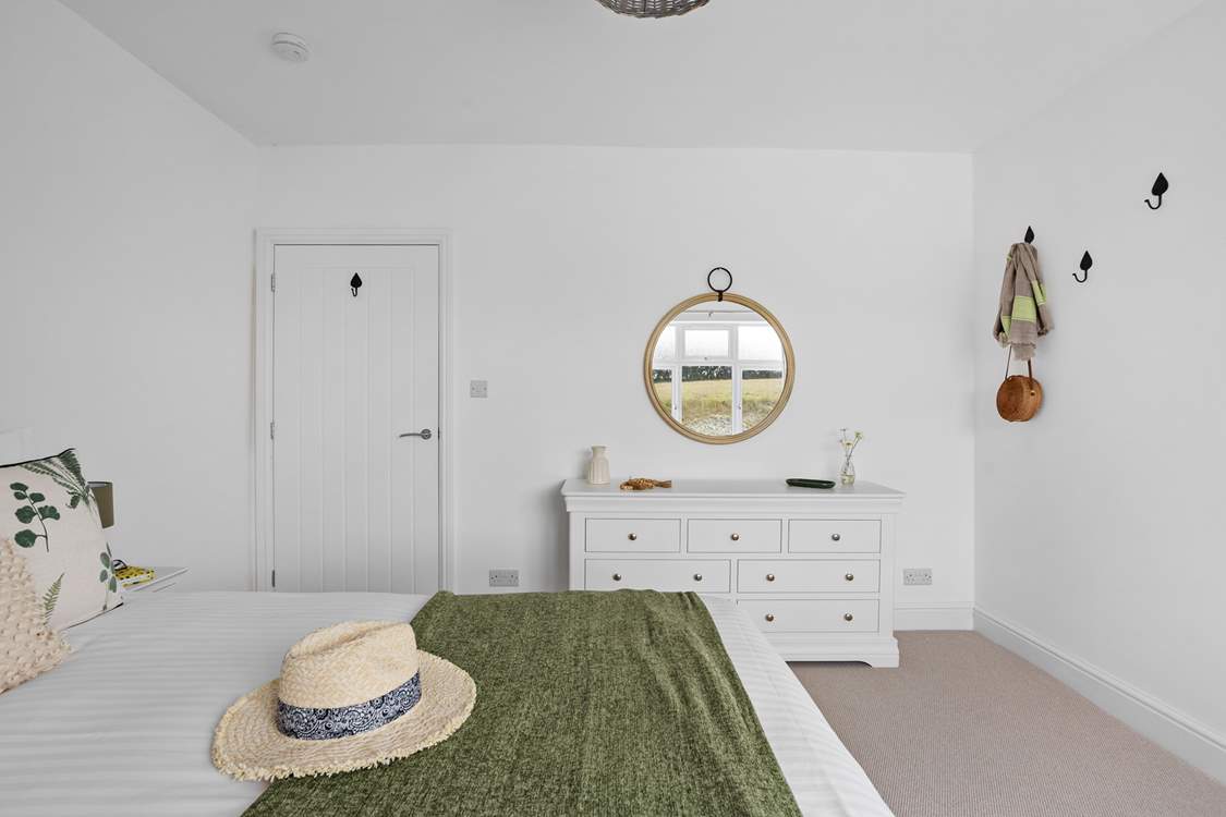 The soft furnishings complement the setting.